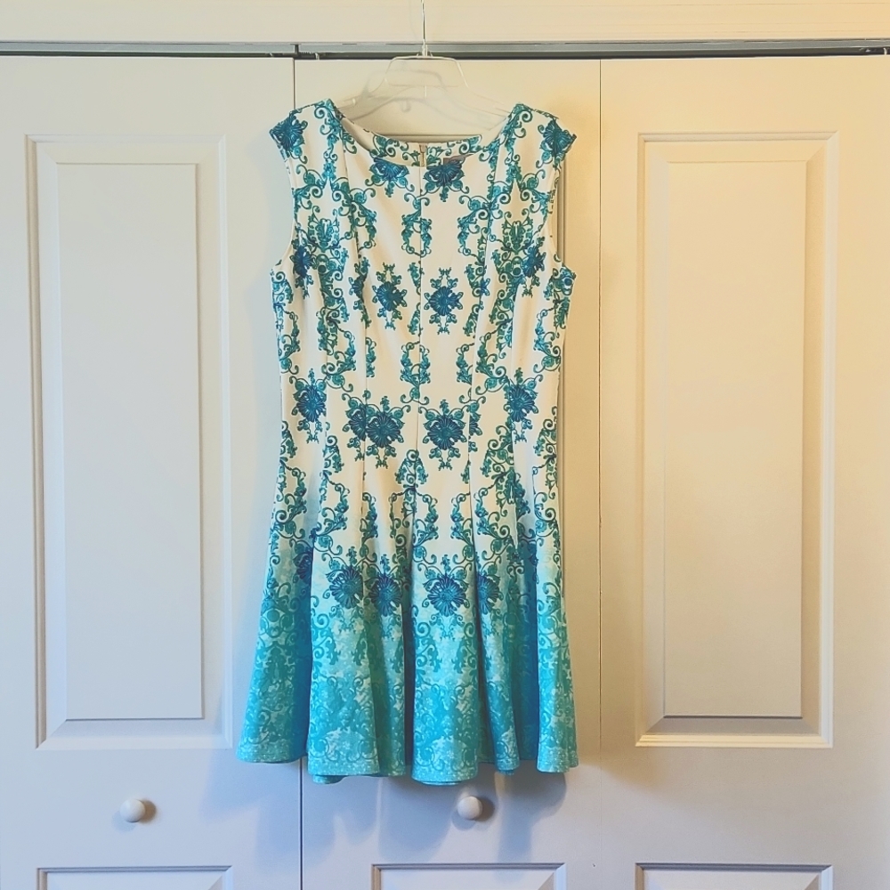 A fitting white and teal dress